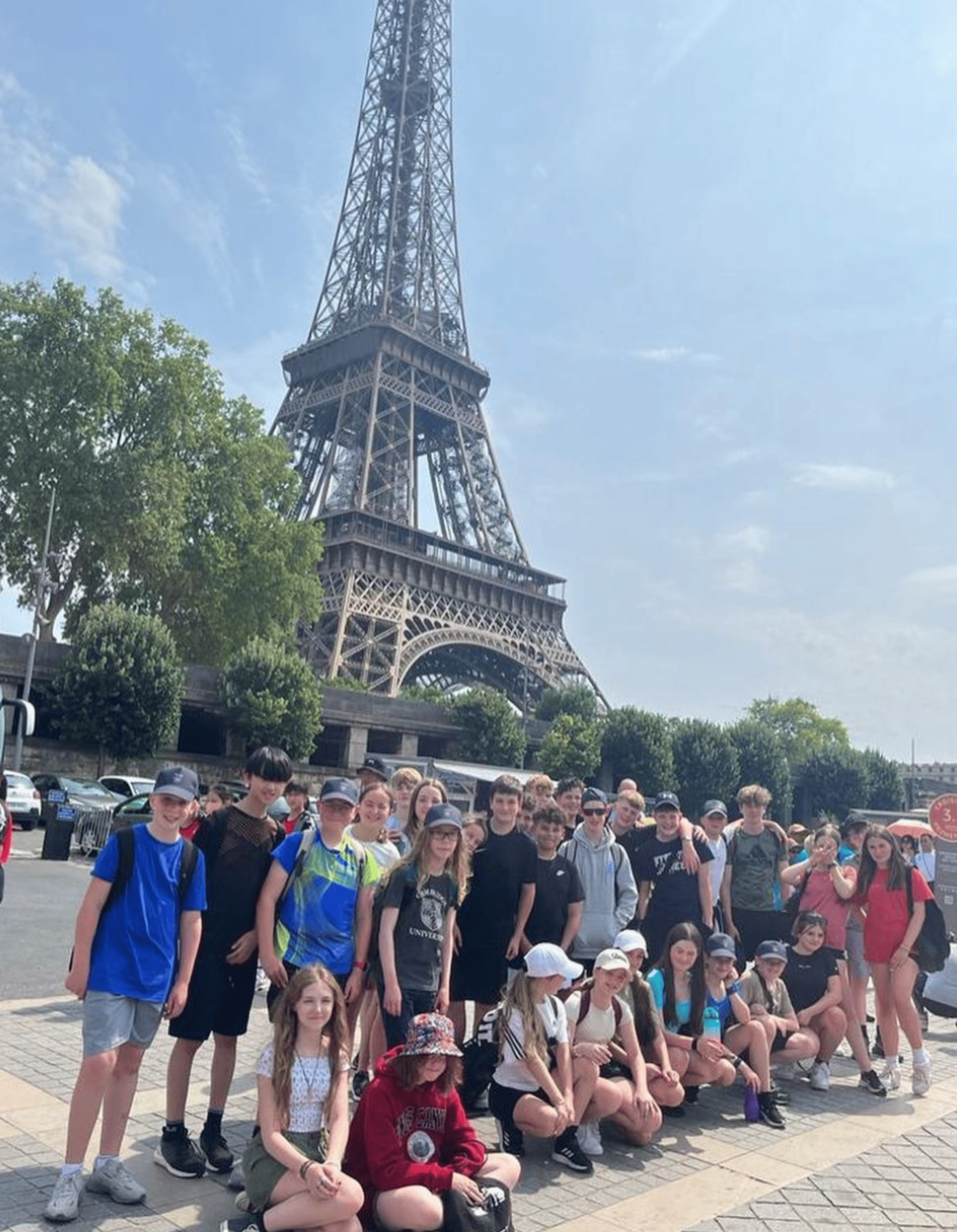 Hazel Grove High School students stand in front of the Eiffel Tower in Paris