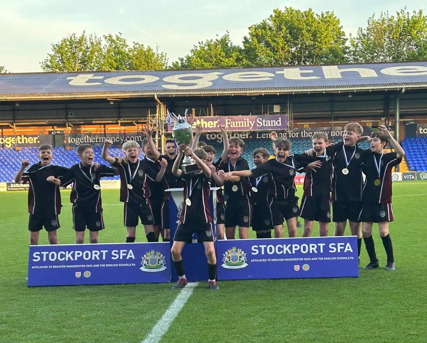 Hazel Grove High School Year 7 football team celebrate as the Stockport Schools Year 7 League winners.
