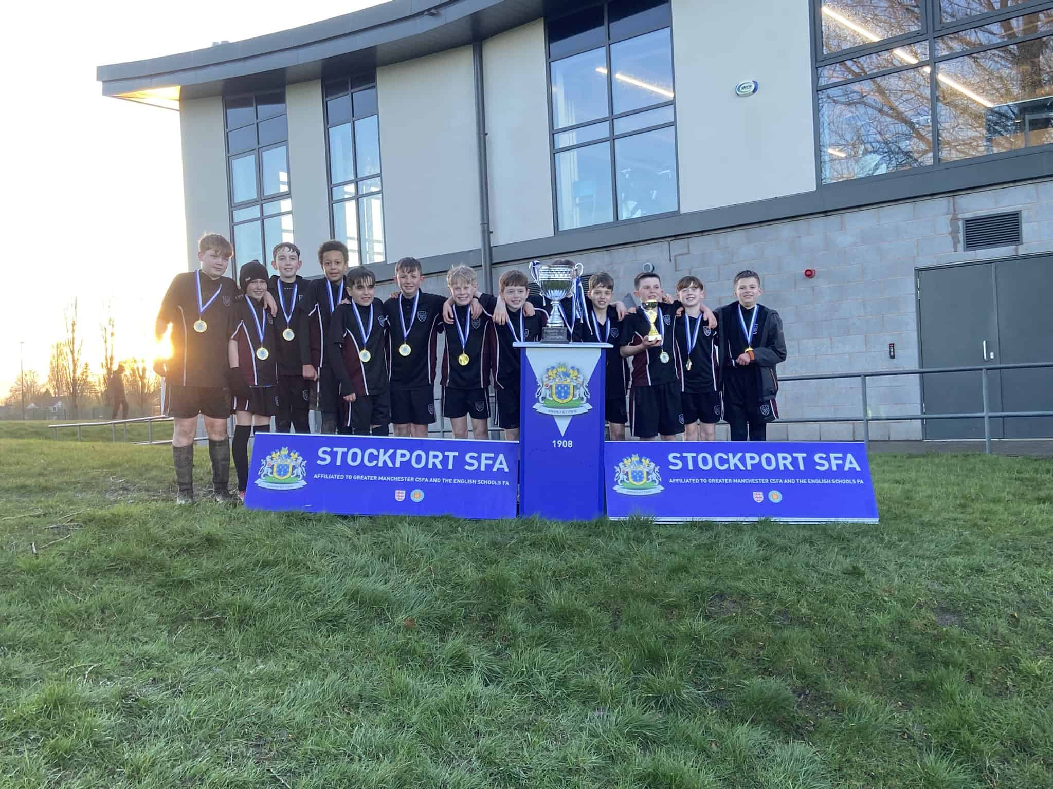 Hazel Grove High School Year 7 football team celebrate as the Stockport Schools Cup winners.