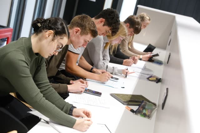 Hazel Grove Sixth Form students focused on their learning, in one of the new learning facilities. 