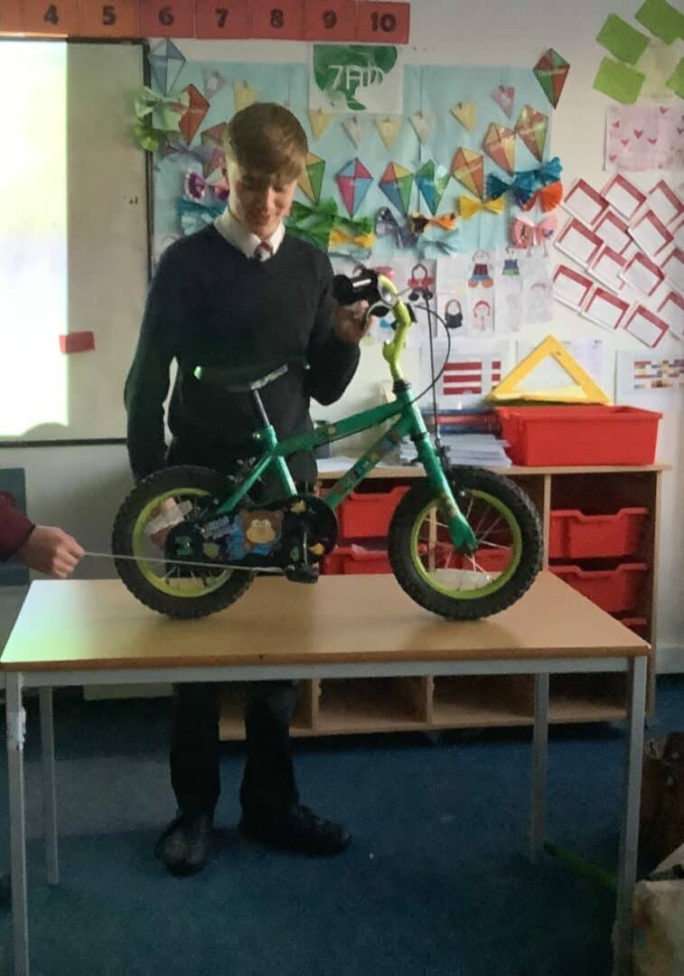 Student tries to find the answer to the question: When the pedals on your bike are moving in a forward circular motion, could the bike be made to travel backwards?
