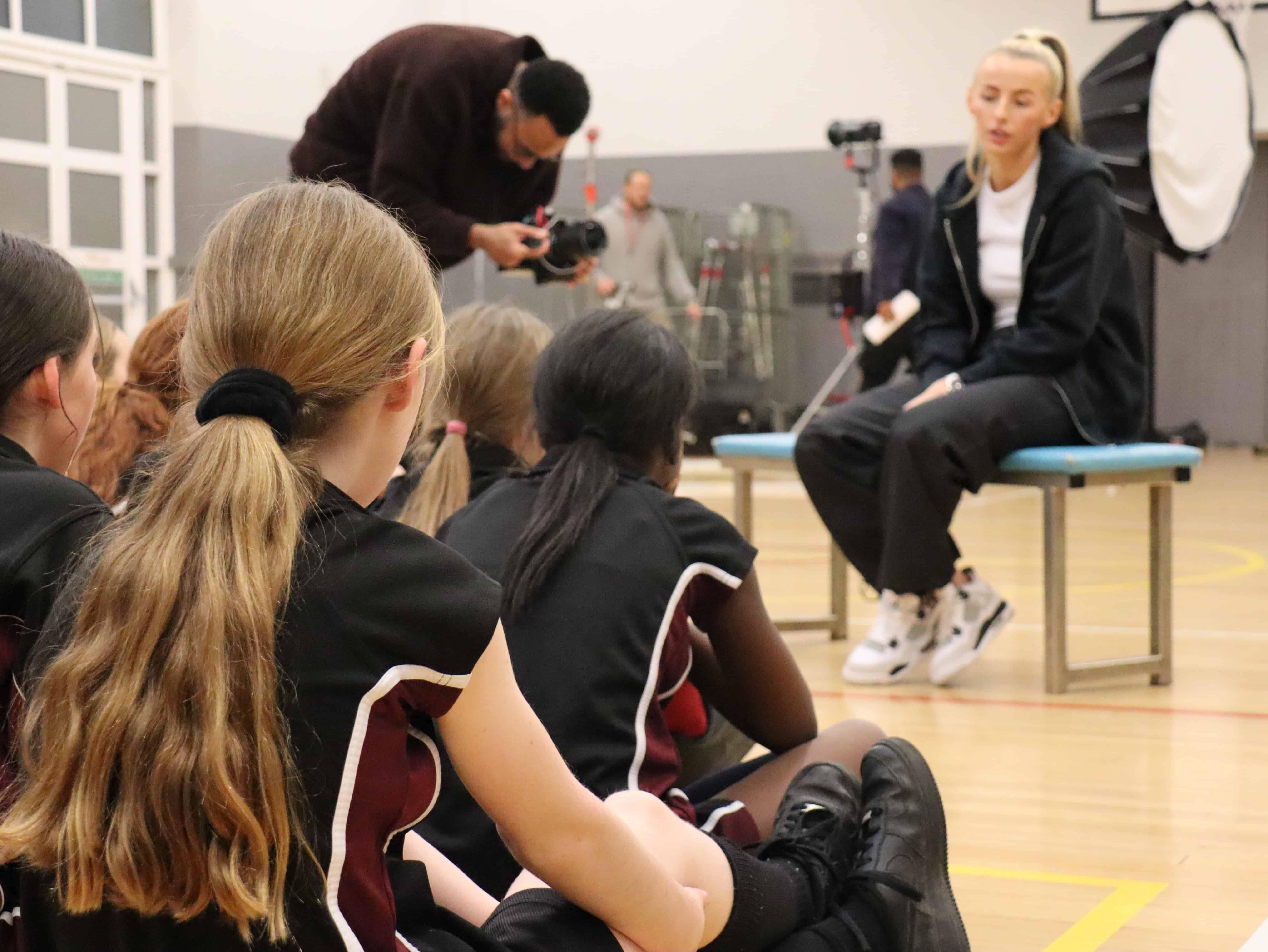 Girls from Hazel Grove High School take part in a Q&A session with footballer Chloe Kelly