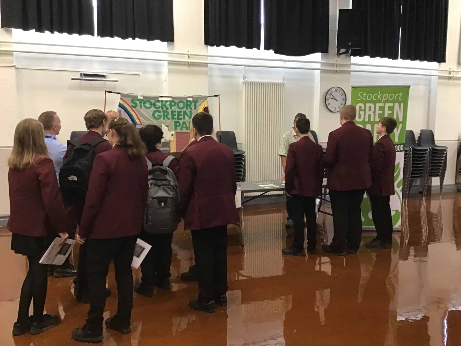 Students gather around the Stockport Green Party stand at the Hazel Grove High School Mock Election 2023.