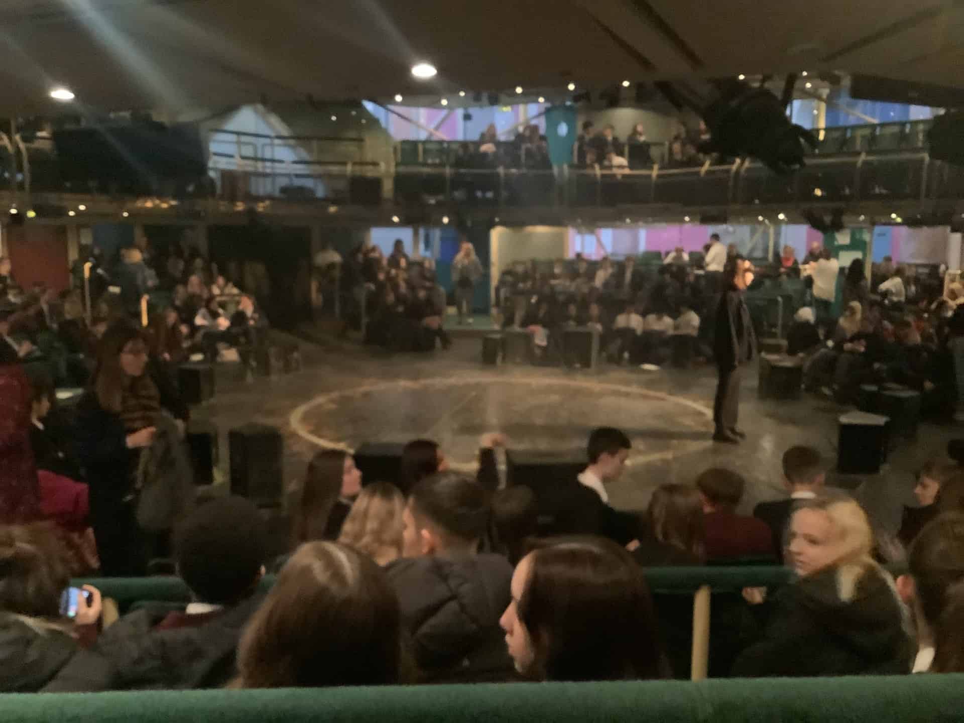 Students from Hazel Grove High School sit around the stage at the Royal Exchange Theatre