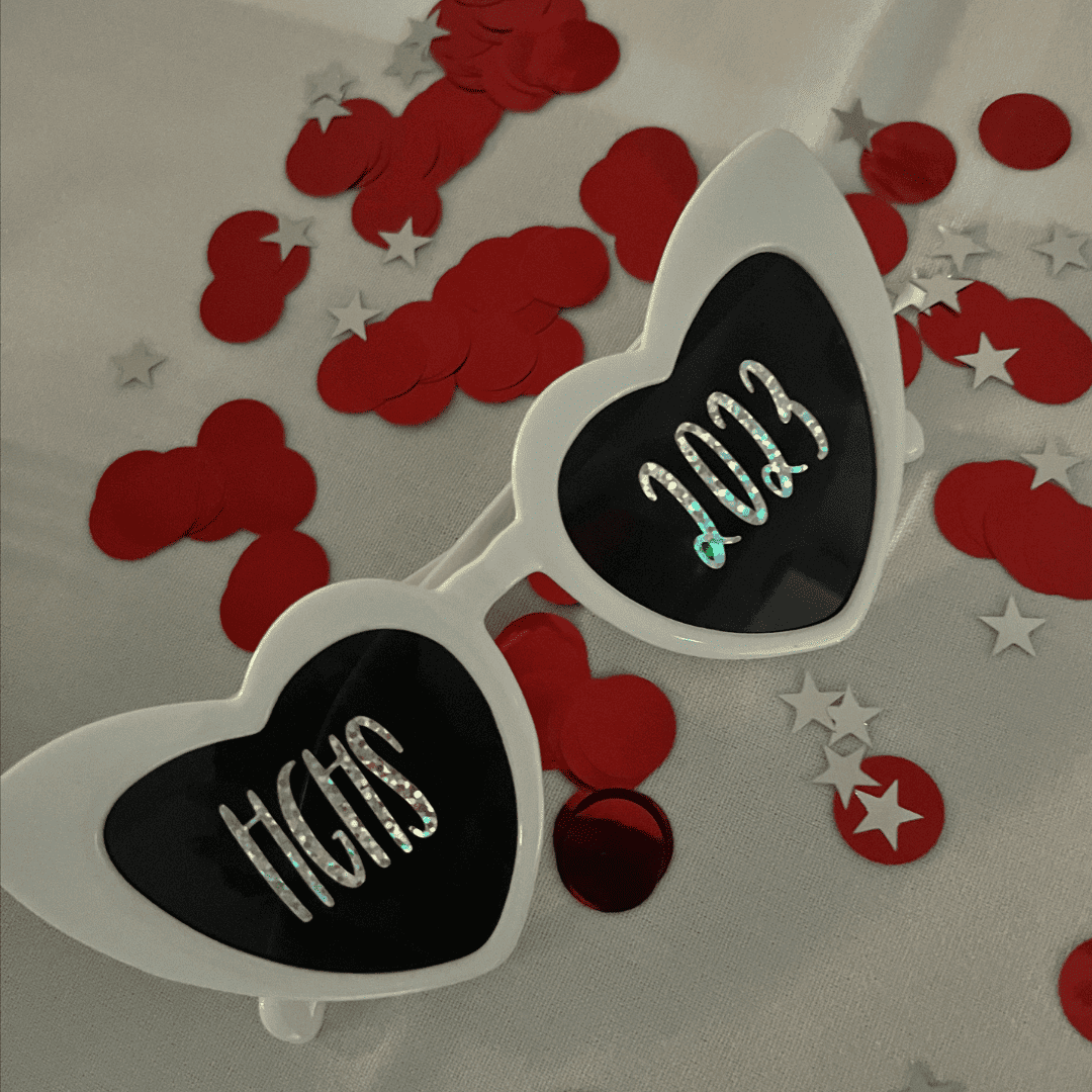 Sunglasses on a decorated table at Hazel Grove High School say HGHS 2023 